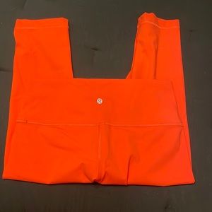 NWOT, bright orange womens lululemon crop leggings. Wunder Under size 10